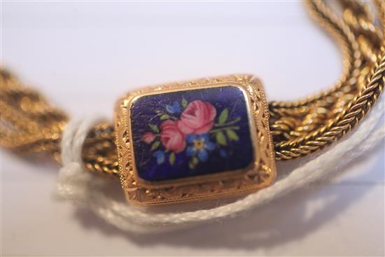 An early 20th century gold triple strand Albertina ropetwist chain, with floral enamelled plaques, gross 38.8 grams.